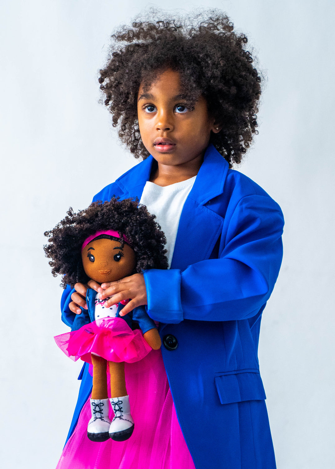Girl holding Bella Plush Doll